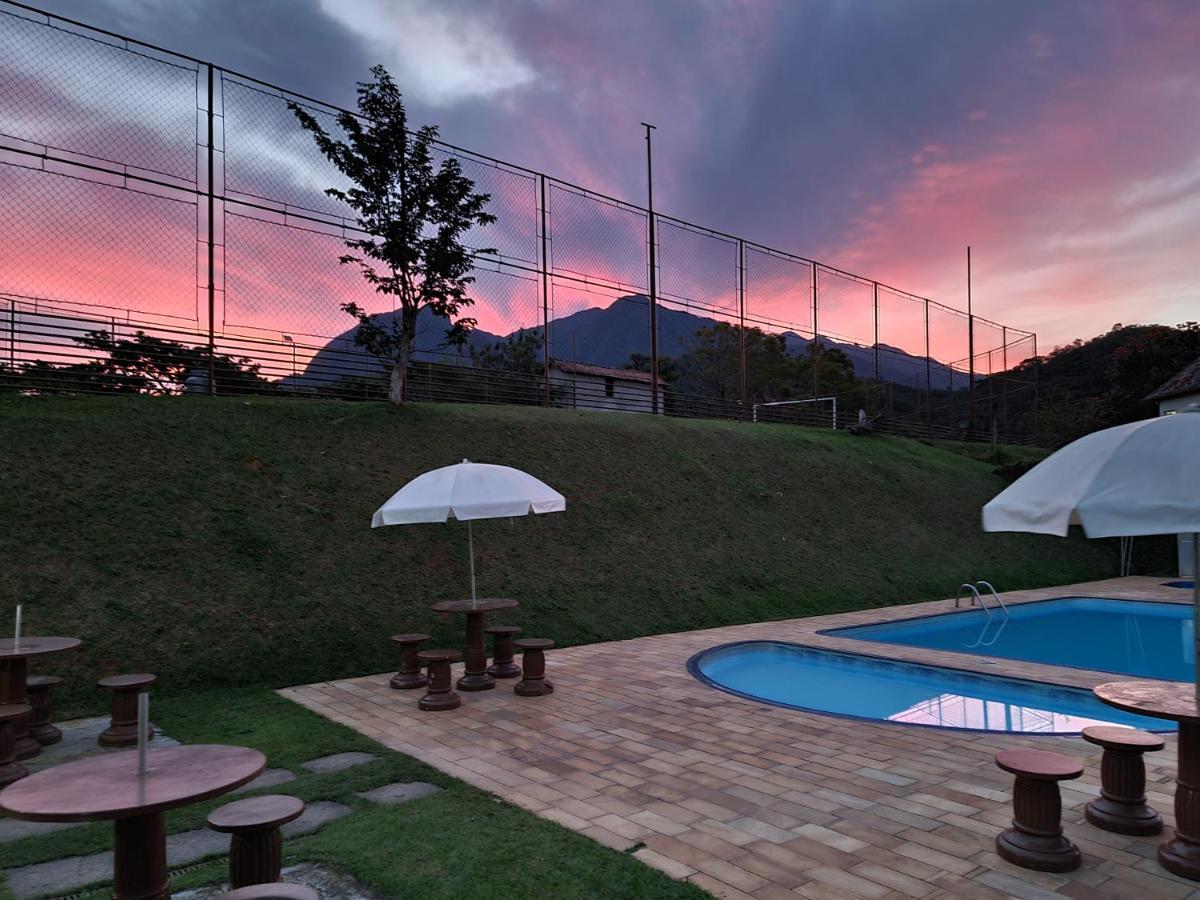 Pousada Nossa Senhora Penedo  Exterior foto Sunset in the city