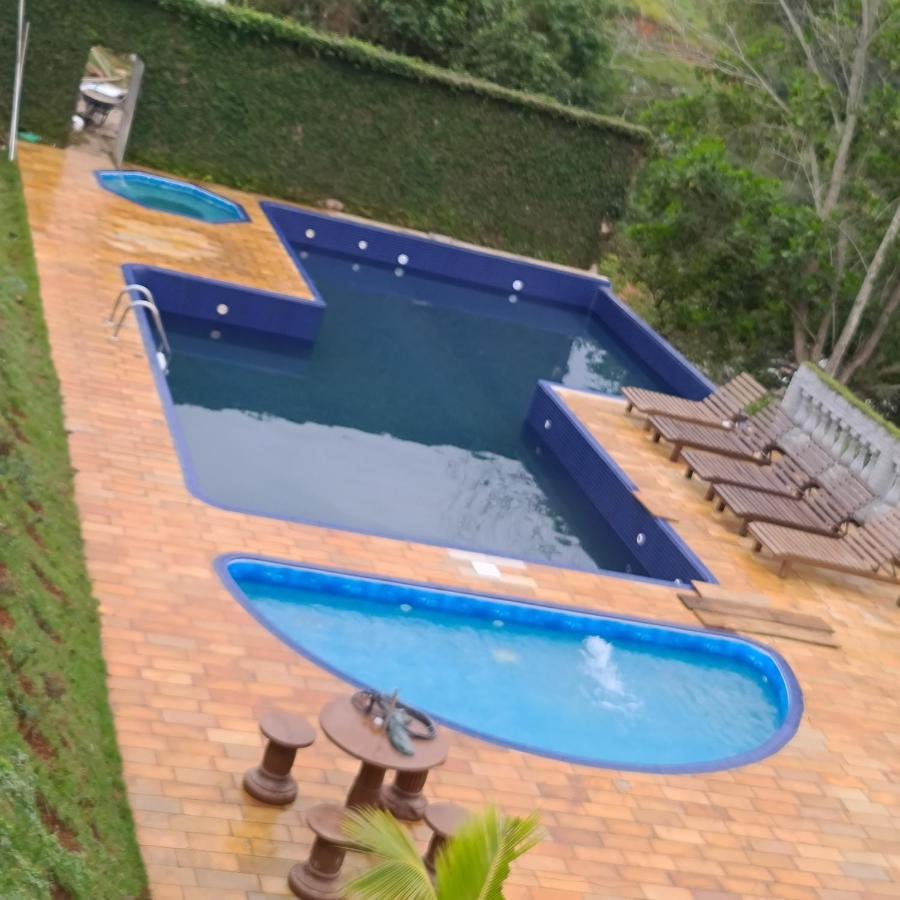 Pousada Nossa Senhora Penedo  Exterior foto Swimming pool at the resort