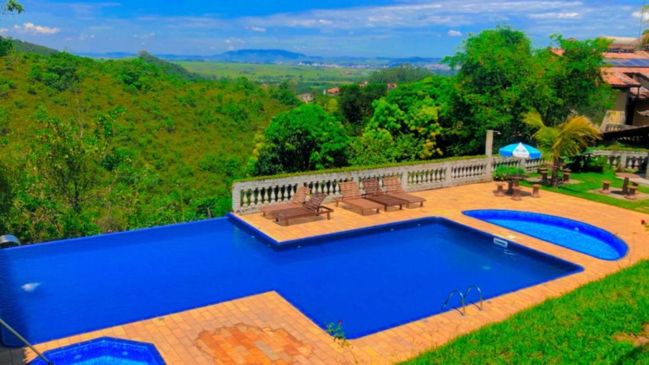 Pousada Nossa Senhora Penedo  Exterior foto View of the swimming pool at the hotel
