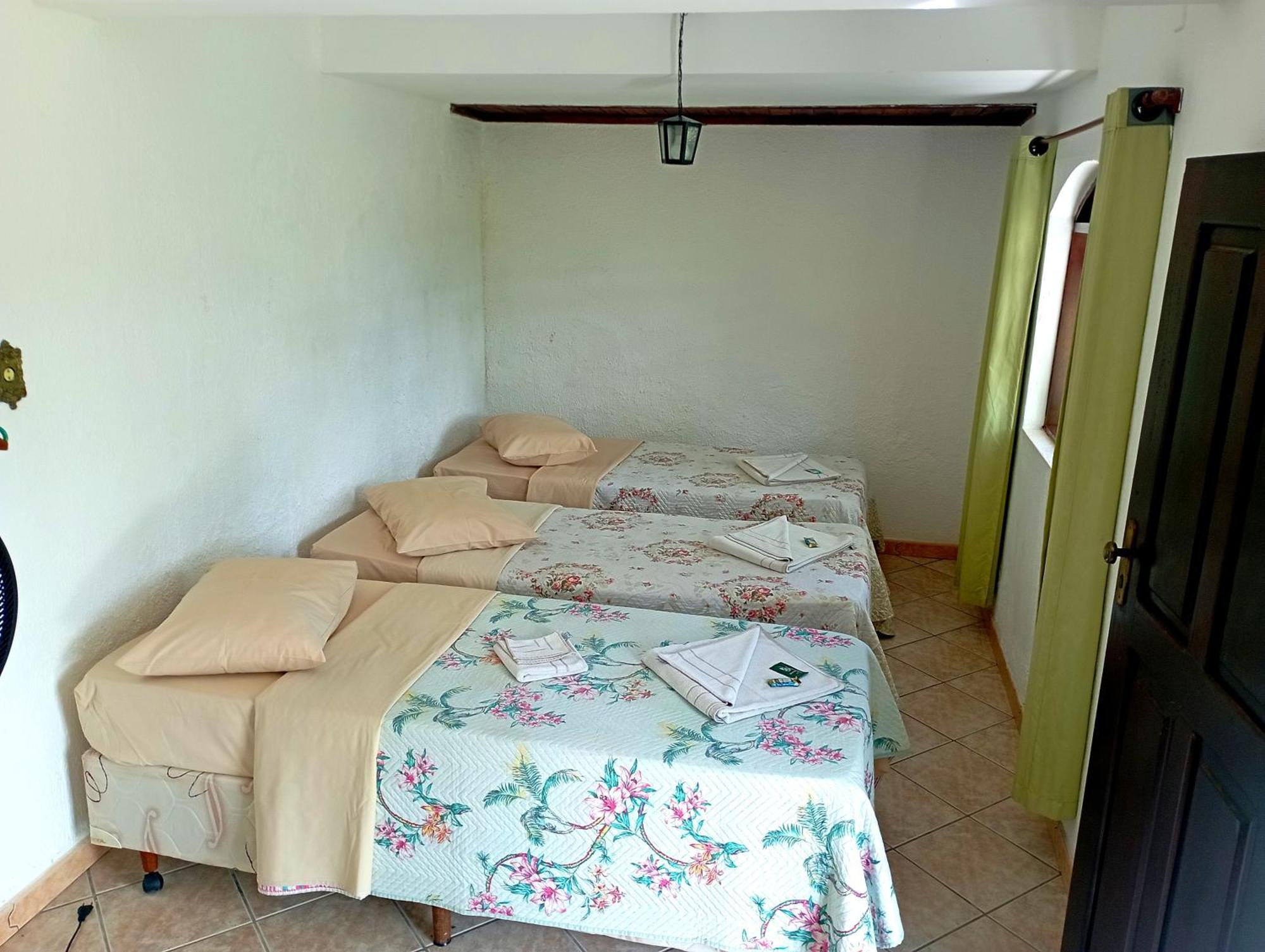 Pousada Nossa Senhora Penedo  Exterior foto A bedroom in a hostel