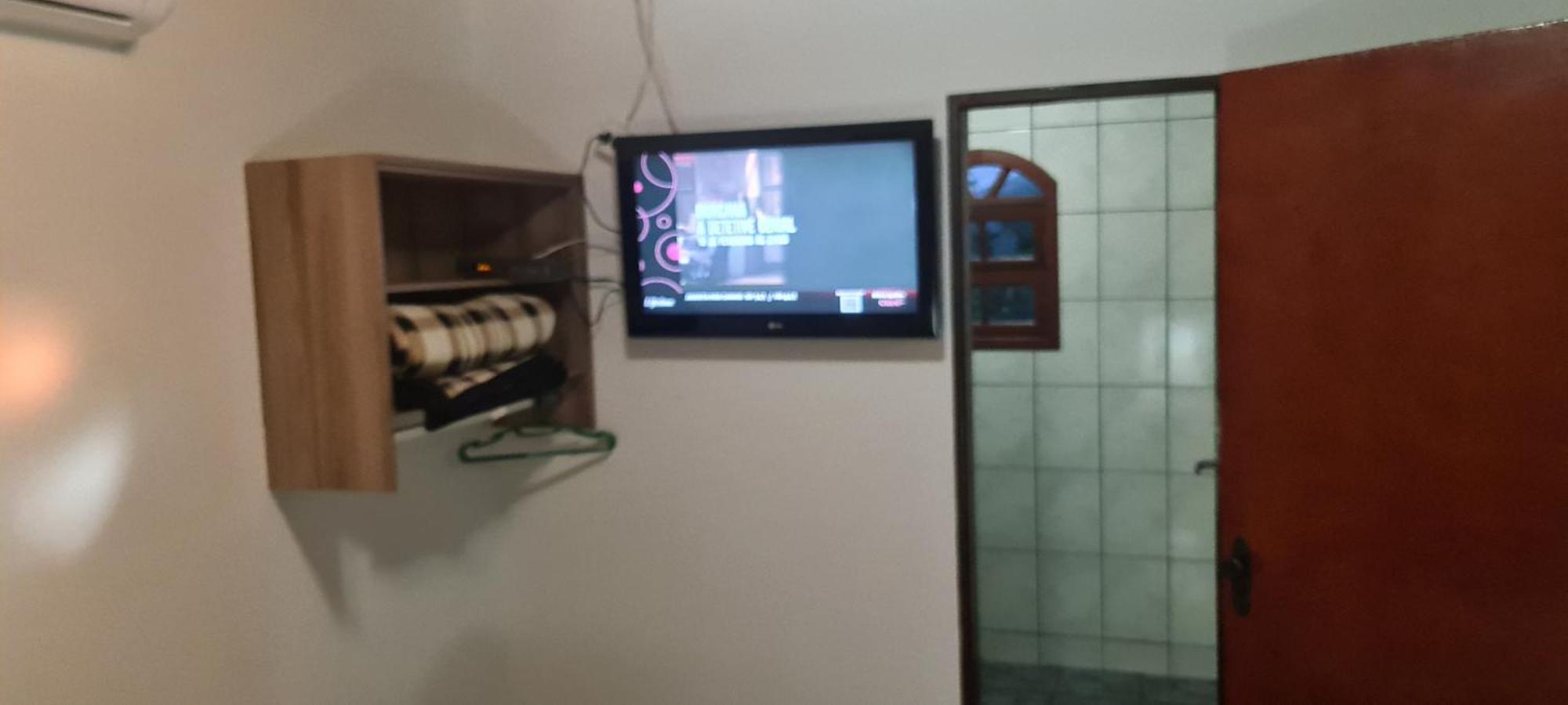 Pousada Nossa Senhora Penedo  Zimmer foto A television set in a hotel room