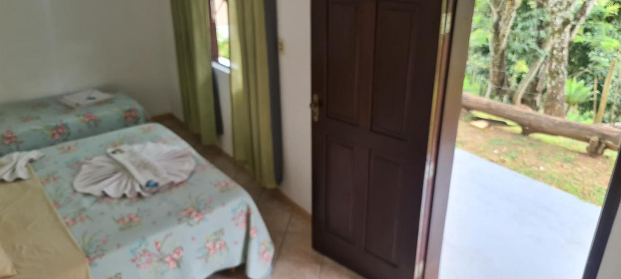 Pousada Nossa Senhora Penedo  Zimmer foto A bedroom in a house in Brazil