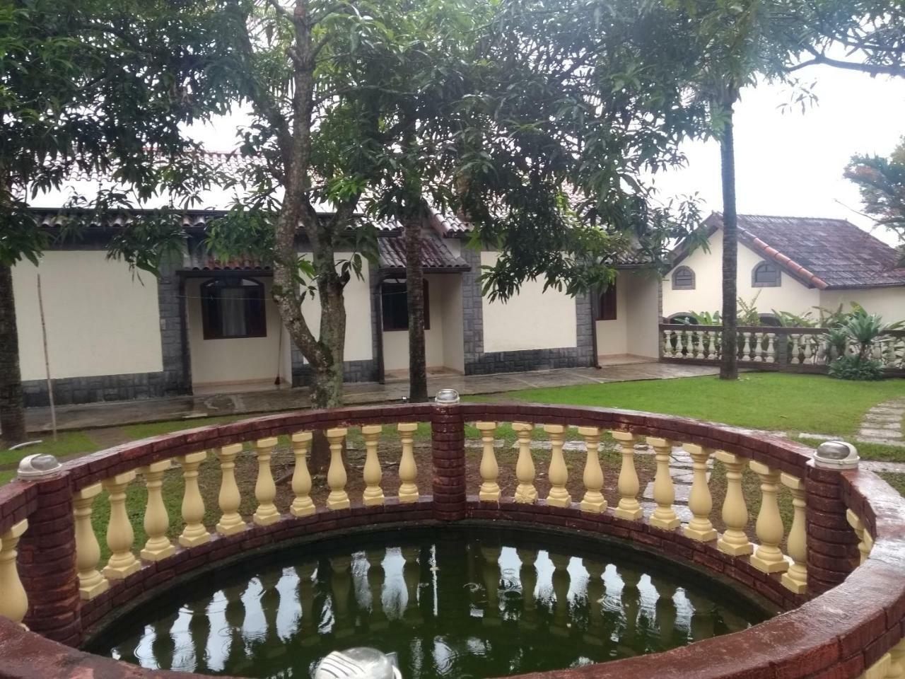 Pousada Nossa Senhora Penedo  Exterior foto The fountain at the front of the house